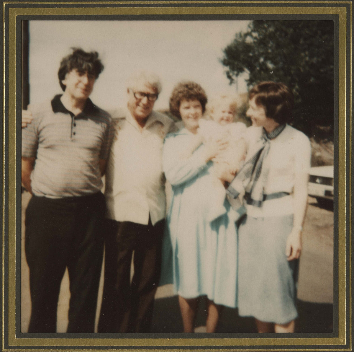 Robert Edwards, Patrick Steptoe, Lesley Brown holding Louise, and Jean Purdy at Louise Brown's first birthday party, July 1979.