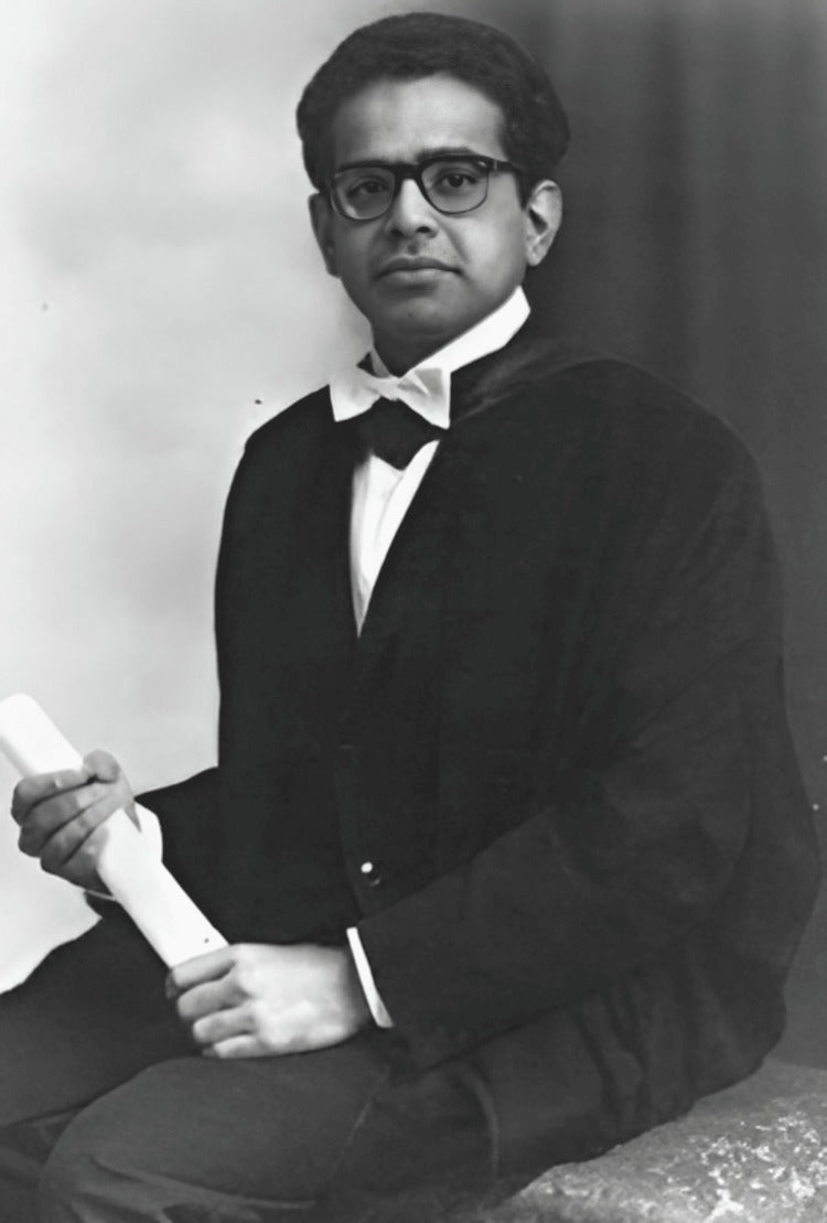 Subhas Mukherjee in academic dress, holding a rolled diploma.